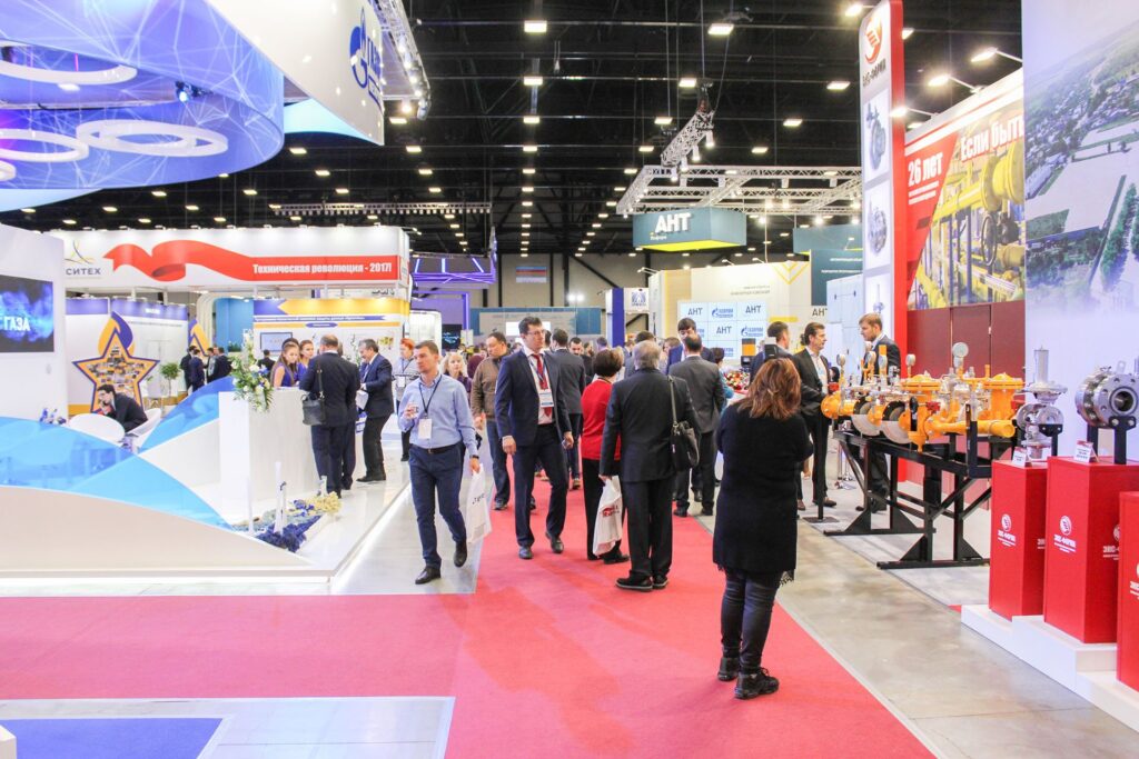 Visitors among the stands of companies.