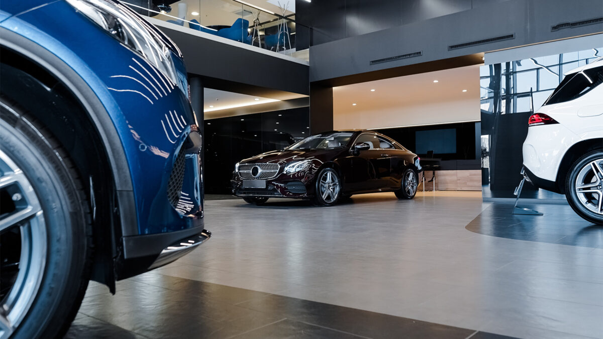 high-end automotive dealership showroom interior focuses on one car